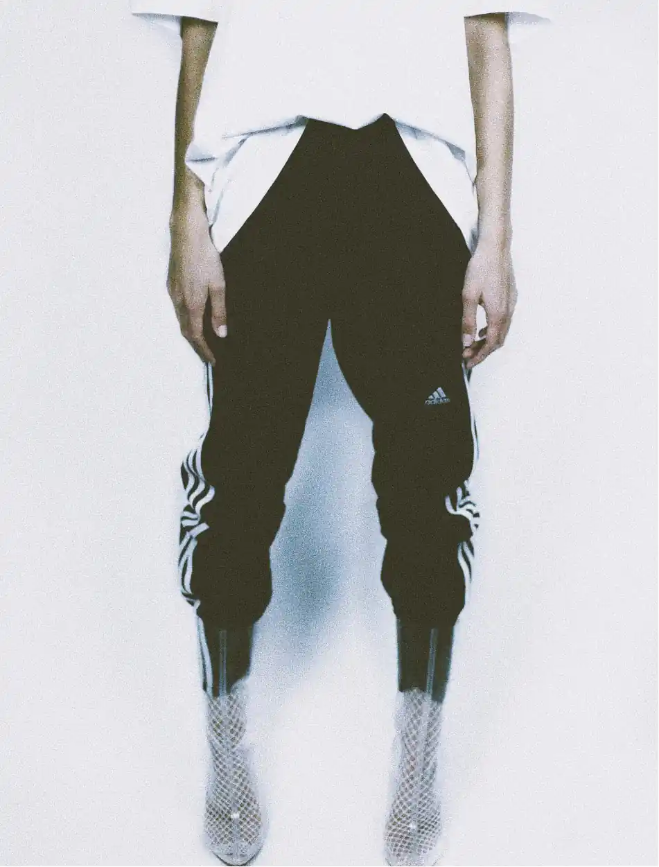 Editorial picture of a woman wearing sport pants with glittering boots